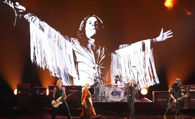 Duff McKagan, from left, Andrew Watt, Chad Smith, Post Malone and Slash perrform "War Pigs" during the in memoriam tribute for the 68th annual Grammy Awards on Sunday, Feb. 1, 2026, in Los Angeles. (AP Photo/Chris Pizzello)