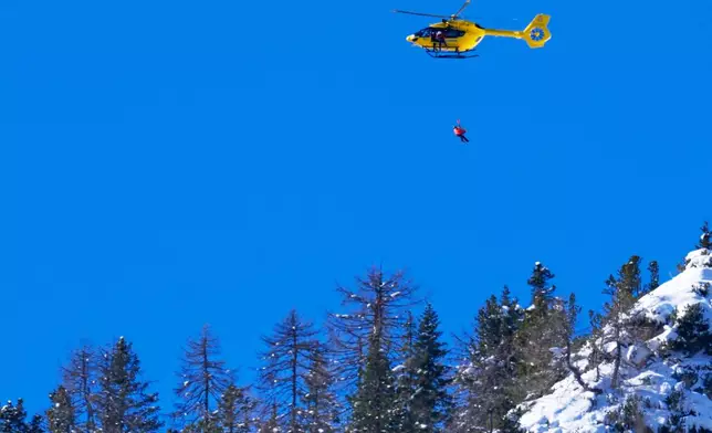 United States' Lindsey Vonn is helicoptered off after crashing, during an alpine ski women's downhill race, at the 2026 Winter Olympics, in Cortina d'Ampezzo, Italy, Sunday, Feb. 8, 2026. (AP Photo/Robert F. Bukaty)
