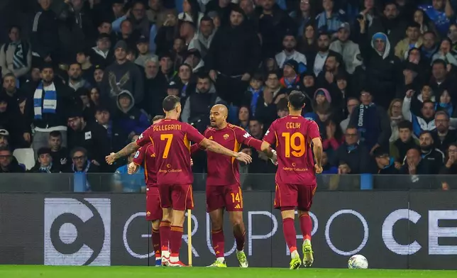 Roma's Donyell Malen, centre, celebrates after scoring the opening goal during the Serie A soccer match between Napoli and Roma in Naples, Italy, Sunday, Feb. 15, 2026. (Alessandro Garofalo/LaPresse via AP)