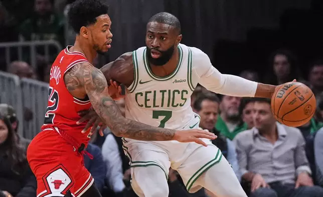 Chicago Bulls guard Anfernee Simons (22) pressures Boston Celtics guard Jaylen Brown (7) during the first half of an NBA basketball game, Wednesday, Feb. 11, 2026, in Boston. (AP Photo/Charles Krupa)