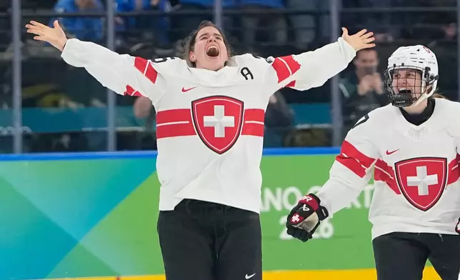 Switzerland's Alina Muller (25) celebrates after a women's ice hockey bronze medal game between Switzerland and Sweden at the 2026 Winter Olympics, in Milan, Italy, Thursday, Feb. 19, 2026. (AP Photo/Hassan Ammar)