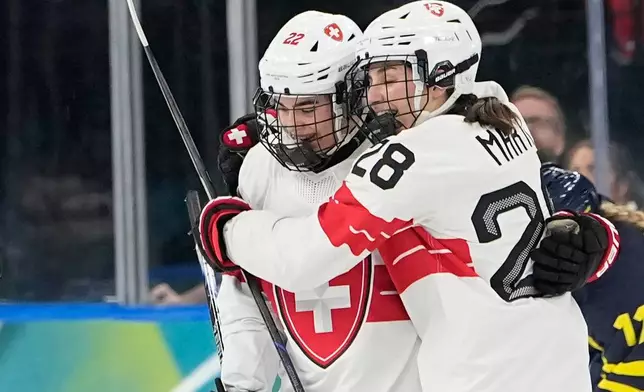 Switzerland's Sinja Leemann (22) celebrates after scoring her side's opening goal during a women's ice hockey bronze medal game between Switzerland and Sweden at the 2026 Winter Olympics, in Milan, Italy, Thursday, Feb. 19, 2026. (AP Photo/Hassan Ammar)