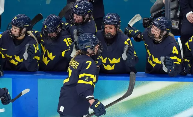 Sweden's Mira Jungaker (7) is congratulated after scoring a goal against Switzerland during the second period of the women's ice hockey bronze medal game at the 2026 Winter Olympics, in Milan, Italy, Thursday, Feb. 19, 2026. (AP Photo/Carolyn Kaster)