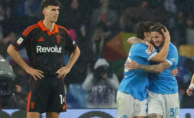 Napoli's Antonio Vergara, second from right, celebrates with Pasquale Mazzocchi after scoring goal against Como during an Italian Cup quarterfinal soccer match, Tuesday, Feb. 10, 2026, in Naples, Italy. (Alessandro Garofalo/LaPresse via AP)