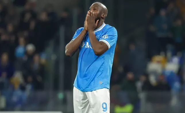 Napoli's Romelu Lukaku reacts after missing a penalty kick during a shoot out against Como in a Italian Cup quarterfinal soccer match, Tuesday, Feb. 10, 2026, in Naples, Italy. (Alessandro Garofalo/LaPresse via AP)