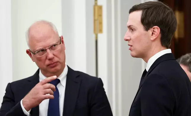 Putin's envoy Kirill Dmitriev, left, gestures speaking to U.S. President Donald Trump's envoy Jared Kushner prior to their meeting with Russian President Vladimir Putin at the Senate Palace of the Kremlin, in Moscow, Thursday, Jan. 22, 2026. (Alexander Kazakov/Sputnik, Kremlin Pool Photo via AP)