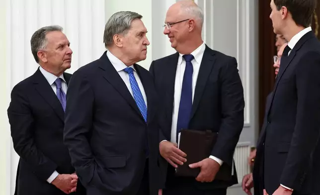 U.S. President Donald Trump's envoy Steve Witkoff, left, Kremlin foreign policy adviser Yuri Ushakov, second left, Putin's envoy Kirill Dmitriev, second right, and Trump's envoy Jared Kushner talk to each other prior to their meeting with Russian President Vladimir Putin at the Senate Palace of the Kremlin, in Moscow, Thursday, Jan. 22, 2026. (Alexander Kazakov/Sputnik, Kremlin Pool Photo via AP)