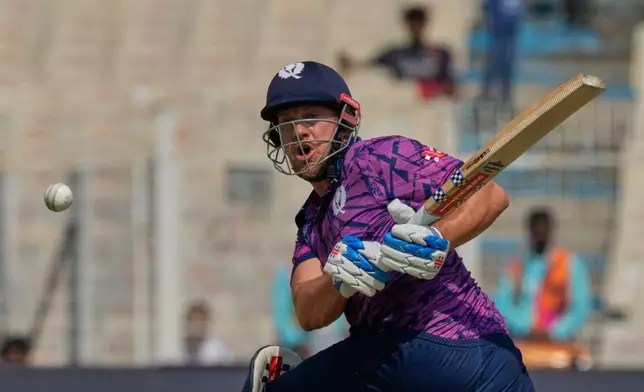 Scotland's George Munsey plays a shot during the T20 World Cup cricket match between Italy and Scotland in Kolkata, India, Monday, Feb. 9, 2026. (AP Photo/Bikas Das)