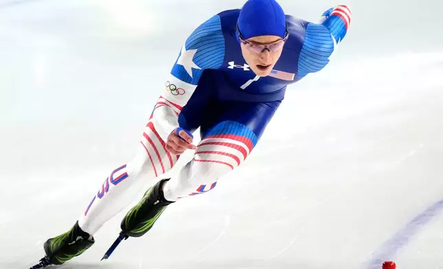 Gold medallist Jordan Stolz of the U.S. competes in the men's 500 meters speedskating race at the 2026 Winter Olympics, in Milan, Italy, Saturday, Feb. 14, 2026. (AP Photo/Luca Bruno)