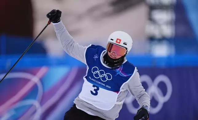 Switzerland's Andri Ragettli celebrates his run during the men's freestyle skiing slopestyle finals at the 2026 Winter Olympics, in Livigno, Italy, Tuesday, Feb. 10, 2026. (AP Photo/Abbie Parr)