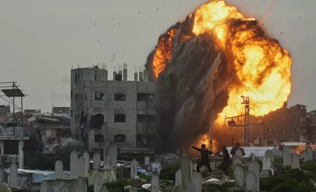 Smoke and flames rise from an Israeli military strike on a building in the Zeitoun neighborhood of Gaza City, Friday, Feb. 6, 2026. (AP Photo/Jehad Alshrafi)