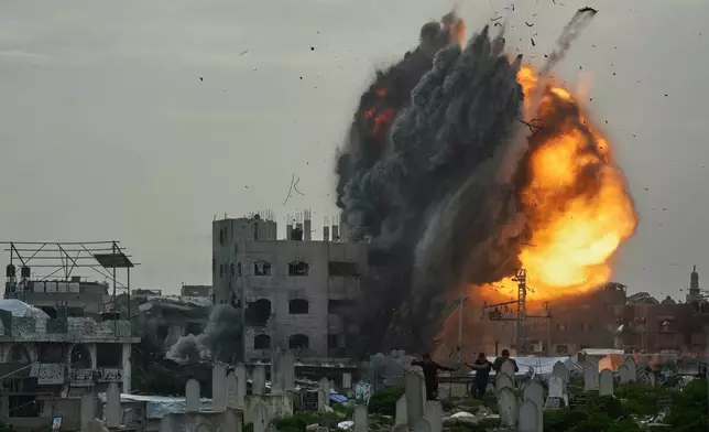 Smoke and flames rise from an Israeli military strike on a building in the Zeitoun neighborhood of Gaza City, Friday, Feb. 6, 2026. (AP Photo/Jehad Alshrafi)