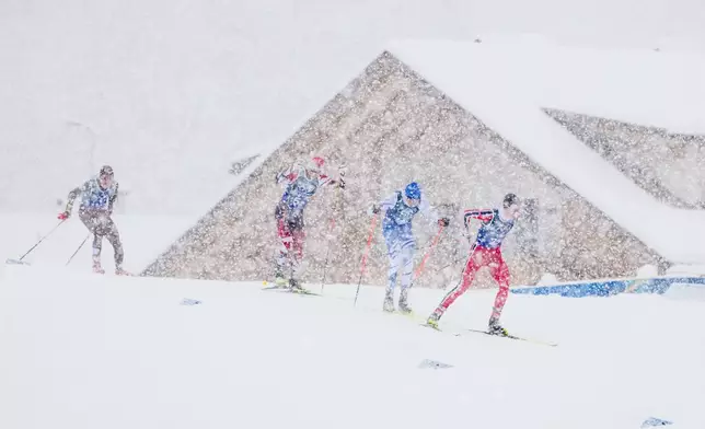 Jens Luraas Oftebro, of Norway, from right, Eero Hirvonen, of Finland and Johannes Lamparter, of Austria, compete in the nordic combined team sprint at the 2026 Winter Olympics, in Tesero, Italy, Thursday, Feb. 19, 2026. (AP Photo/Kirsty Wigglesworth)