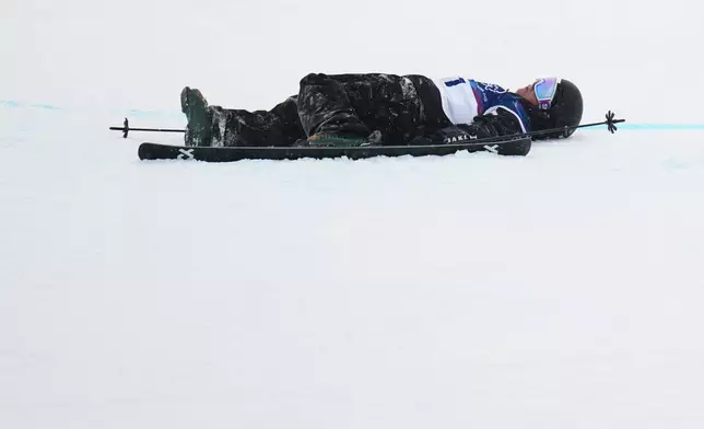 New Zealand's Finley Melville Ives crashes during the men's freestyle skiing halfpipe qualifications at the 2026 Winter Olympics, in Livigno, Italy, Friday, Feb. 20, 2026. (AP Photo/Julia Demaree Nikhinson)