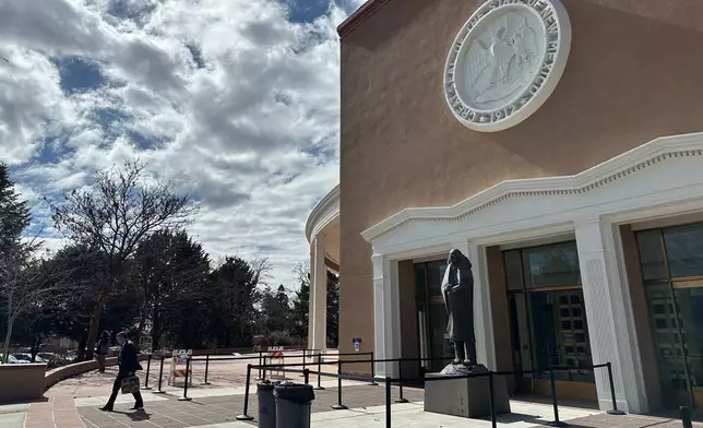 A man exits the state Capitol in Santa Fe, N.M., where state lawmakers on Tuesday, Feb. 17, 2026, launched an investigation into past activity at a secluded desert ranch where financier and sex offender Jeffrey Epstein once entertained guests, and whether local authorities looked the other way. (AP Photo/Morgan Lee)