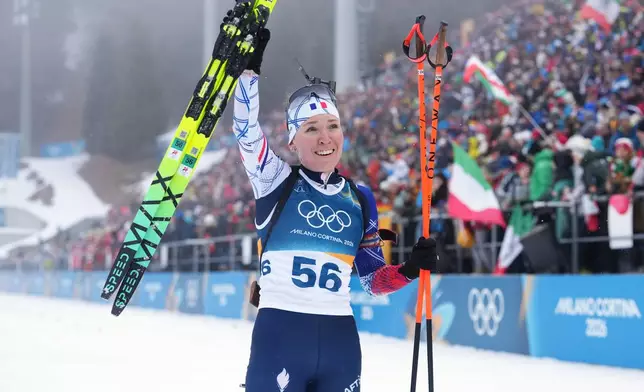 Oceane Michelon, of France, reacts in the finish area during the women's 7.5-kilometer sprint biathlon race at the 2026 Winter Olympics in Anterselva, Italy, Saturday, Feb. 14, 2026. (AP Photo/Andrew Medichini)