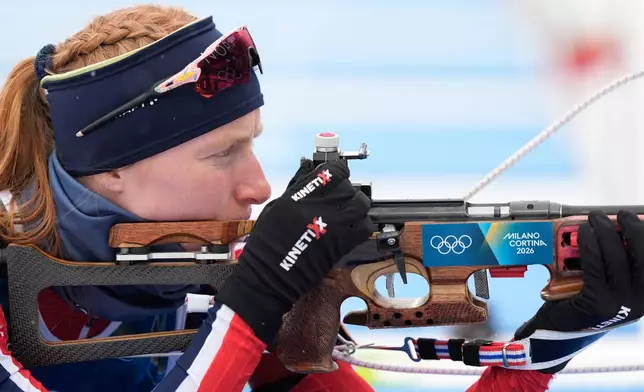 Maren Kirkeeide, of Norway, prepares to shot ahead of the women's 7.5-kilometer sprint biathlon race at the 2026 Winter Olympics in Anterselva, Italy, Saturday, Feb. 14, 2026. (AP Photo/Andrew Medichini)