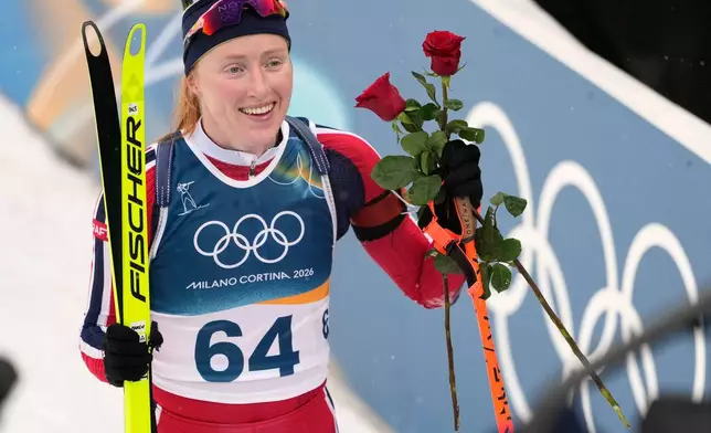 Maren Kirkeeide, of Norway, reacts after the women's 7.5-kilometer sprint biathlon race at the 2026 Winter Olympics in Anterselva, Italy, Saturday, Feb. 14, 2026. (AP Photo/Mosa'ab Elshamy)