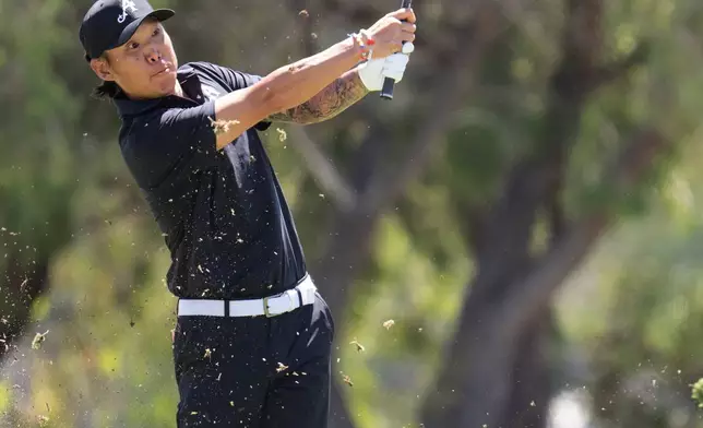 Anthony Kim of 4Aces GC hits his shot from the second fairway during the final round of the LIV Golf Adelaide at Grange Golf Club in Adelaide, Australia Sunday, Feb. 15, 2026. (Charles Laberge/LIV Golf via AP)