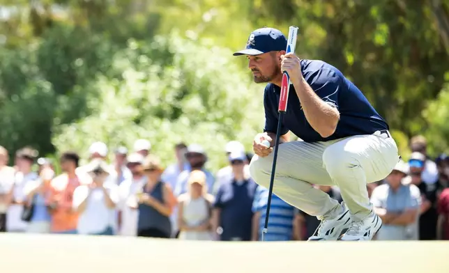 Captain Bryson DeChambeau of Crushers GC reads his putt on the second green during the final round of the LIV Golf Adelaide at Grange Golf Club in Adelaide, Australia Sunday, Feb. 15, 2026. (Charles Laberge/LIV Golf via AP)