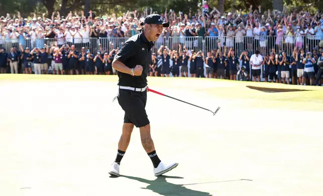 Anthony Kim of 4Aces GC reacts to his putt on the 18th green during the final round of the LIV Golf Adelaide at Grange Golf Club in Adelaide, Australia Sunday, Feb. 15, 2026. (Charles Laberge/LIV Golf via AP)
