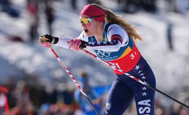 Jessie Diggins, of the United States, competes in the cross-country skiing women's team sprint free at the 2026 Winter Olympics, in Tesero, Italy, Wednesday, Feb. 18, 2026. (AP Photo/Kirsty Wigglesworth)