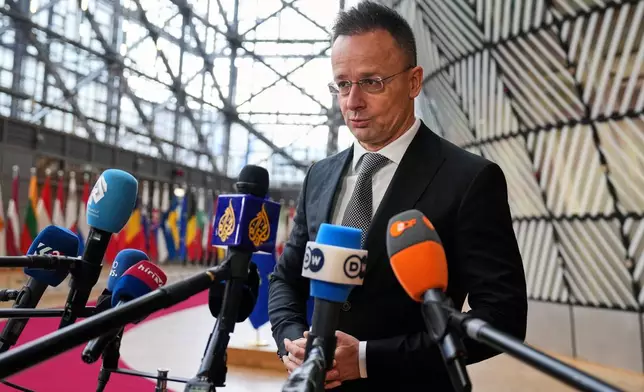 Hungary's Foreign Minister Peter Szijjarto speaks with the media as he arrives for a meeting of EU foreign ministers at the European Council building in Brussels, Monday, Feb. 23, 2026. (AP Photo/Virginia Mayo)