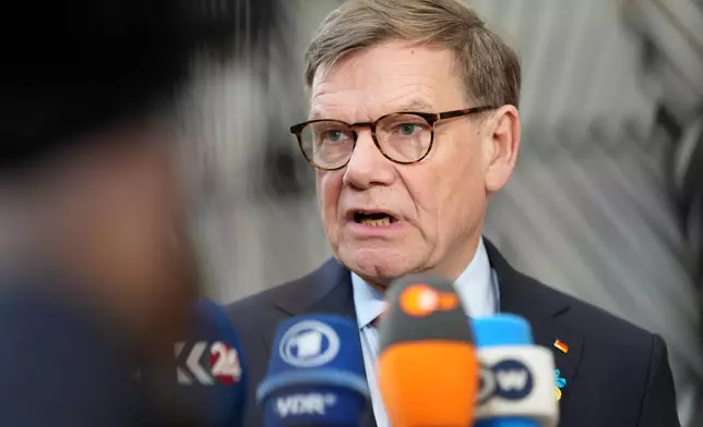 Germany's Foreign Minister Johann Wadephul speaks with the media as he arrives for a meeting of EU foreign ministers at the European Council building in Brussels, Monday, Feb. 23, 2026. (AP Photo/Virginia Mayo)