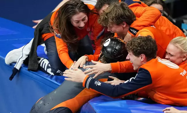Gold medalist Jens van 't Wout of the Netherlands celebrates after the short track speed skating men's 1500m final at the 2026 Winter Olympics, in Milan, Italy, Saturday, Feb. 14, 2026. (AP Photo/Francisco Seco)