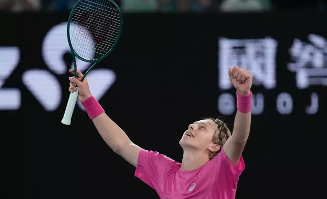 Ziga Sesko of Slovenia celebrates after defeating Keaton Hance of the U.S. in the boy's singles final at the Australian Open tennis championship in Melbourne, Australia, Sunday, Feb. 1, 2026. (AP Photo/Dar Yasin)