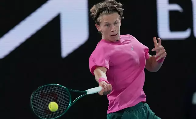 Ziga Sesko of Slovenia plays a forehand return to Keaton Hance of the U.S. during the boy's singles final at the Australian Open tennis championship in Melbourne, Australia, Sunday, Feb. 1, 2026. (AP Photo/Dar Yasin)