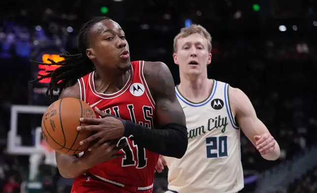 Chicago Bulls' Ayo Dosunmu loses the ball in front of Milwaukee Bucks' AJ Green during the first half of an NBA basketball game Tuesday, Feb. 3, 2026, in Milwaukee. (AP Photo/Morry Gash)