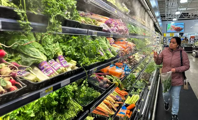 A person shops at a grocery store in Schaumburg, Ill., Monday, Feb. 9, 2026. (AP Photo/Nam Y. Huh)