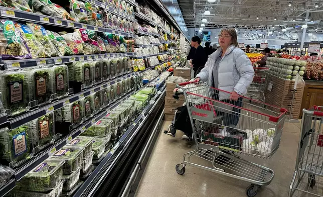 Shoppers shop at a grocery store in Schaumburg, Ill., Monday, Feb. 9, 2026. (AP Photo/Nam Y. Huh)