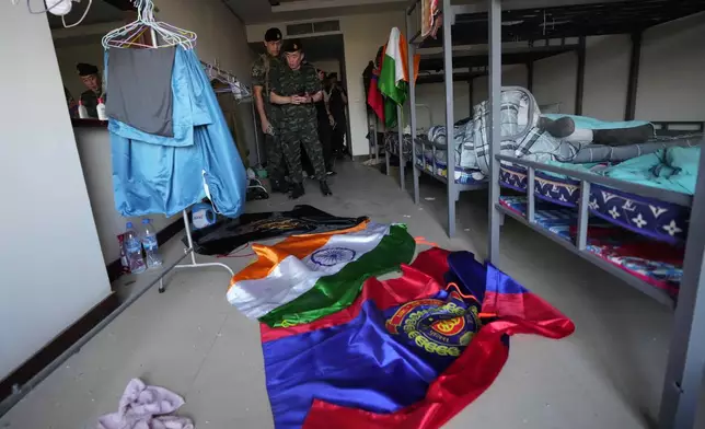 Thai soldiers inspect an abandoned bedroom at a scam center in O'Smach, Cambodia, Monday, Feb. 2, 2026. (AP Photo/Sakchai Lalit)