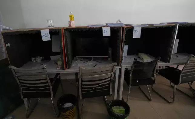 A work station lined with foam for soundproofing is seen inside a scam compound in O'Smach, Cambodia, Monday, Feb. 2, 2026, (AP Photo/Sakchai Lalit)