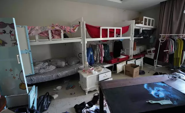 An abandoned bedroom is seen at a scam center in O Smach, Cambodia, Monday, Feb. 2, 2026. (AP Photo/Sakchai Lalit)