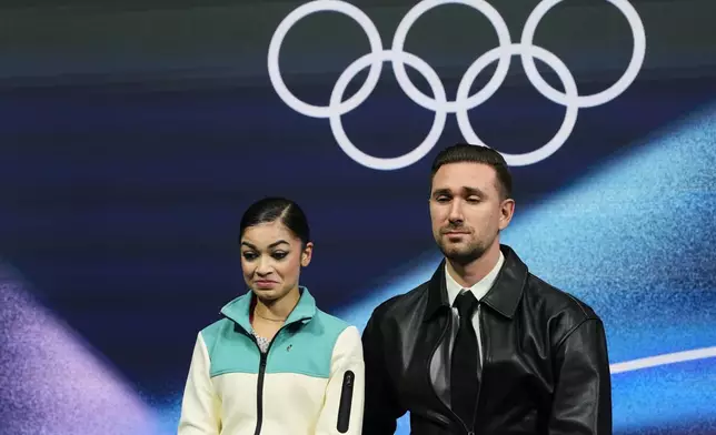 Adeliia Petrosian of Individual Neutral Athletes reacts to her score after competing in the women's short program in figure skating at the 2026 Winter Olympics, in Milan, Italy, Tuesday, Feb. 17, 2026. (AP Photo/Natacha Pisarenko)