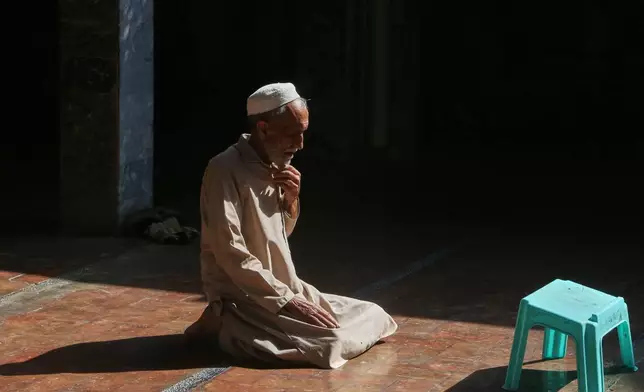 A Muslim attends afternoon prayer during the holy fasting month of Ramadan, at a mosque in Peshawar, Pakistan, Tuesday, Feb. 24, 2026. (AP Photo/Muhammad Sajjad)