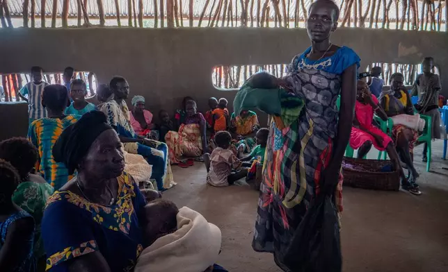 Nyaphan Nyang Lual, 36 years old, an internally displaced person, shelters at a church compound in Akobo, South Sudan, Saturday, Feb. 21, 2026. (AP Photo/Florence Miettaux)