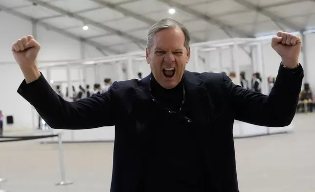Creative Director and Executive Producer Marco Balich gestures as volunteer dancers perform during rehearsals for the opening ceremony of the Milan Cortina 2026 Winter Olympic Games, at a compound in a big tent next to San Siro Stadium, in Milan, Italy, Saturday, Jan. 24, 2026. (AP Photo/Luca Bruno)