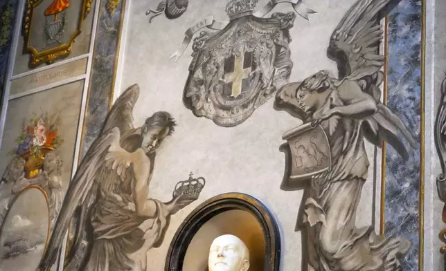 A restored chapel with Angels depicted on a fresco to the memory of late Italy's King Umberto II is seen inside the Basilica of St. Lawrence in Lucina in Rome, Sunday, Feb. 1, 2026. (AP Photo/Gregorio Borgia)