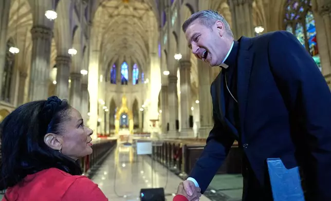 Archbishop-designate Ronald Hicks greets journalists before a news conference at St. Patrick's Cathedral in New York, Thursday, Feb. 5, 2026. (AP Photo/Seth Wenig)