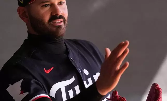 Minnesota Twins pitcher Pablo Lopez warms up during a spring training baseball workout in Fort Myers, Fla., Monday, Feb. 16, 2026. (AP Photo/Gerald Herbert)
