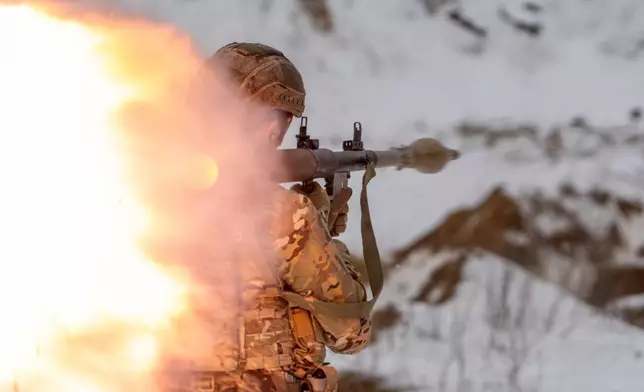 Ukrainian servicemen of special police unit take part in training at the training field in Kharkiv region, Ukraine, Friday, Feb. 13, 2026. (AP Photo/Andrii Marienko)