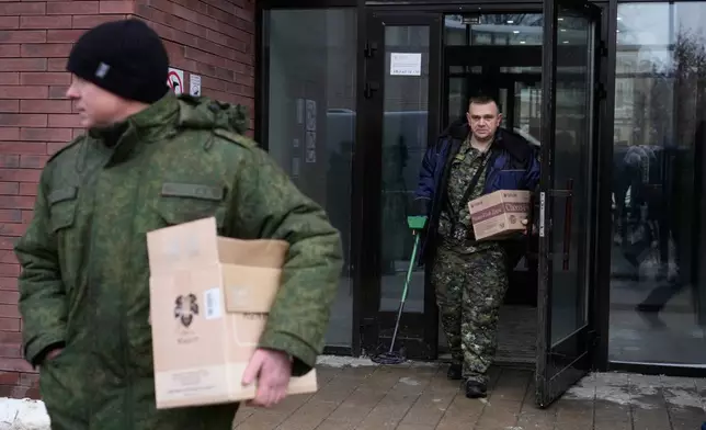 Investigators leave an apartment building where deputy chief of Russian military intelligence Lt. Gen. Vladimir Alekseyev was shot and wounded, in Moscow, Russia, Friday, Feb. 6, 2026. (AP Photo/Pavel Bednyakov)