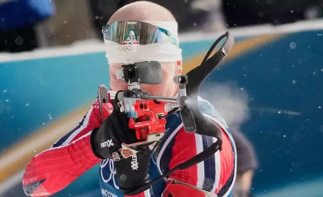 Norway's Johannes Dale-Skjevdal shoots during the men's biathlon 15-kilometers mass start race at the 2026 Winter Olympics, in Anterselva, Italy, Friday, Feb. 20, 2026. (AP Photo/David J. Phillip)