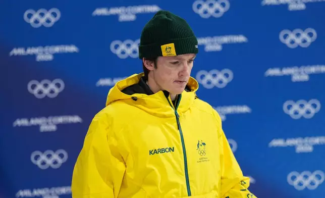 Silver medalist Australia's Scotty James reacts as he arrives for the medal ceremony after the men's snowboarding halfpipe finals at the 2026 Winter Olympics, in Livigno, Italy, Friday, Feb. 13, 2026. (AP Photo/Abbie Parr)