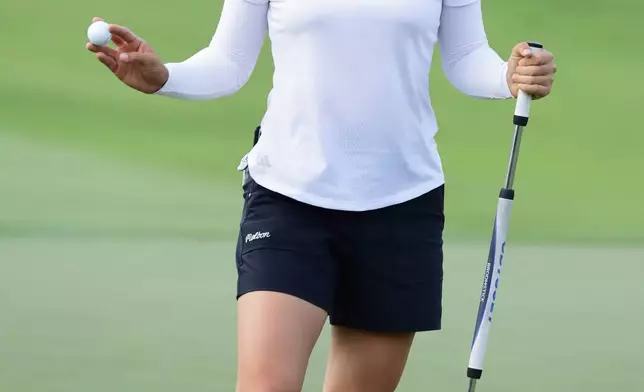 Minjee Lee of Australia reacts on the green during the HSBC Women's World Championship at Sentosa Golf Club in Singapore, Thursday, Feb. 26, 2026. (AP Photo/Suhaimi Abdullah)