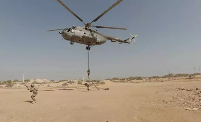 In this image provided by Sepahnews of the Iranian Revolutionary Guard on Feb. 16, 2026, shows the Iranian Revolutionary Guard's drill in the Persian Gulf on Monday, Feb. 16, 2026. (Sepahnews via AP)